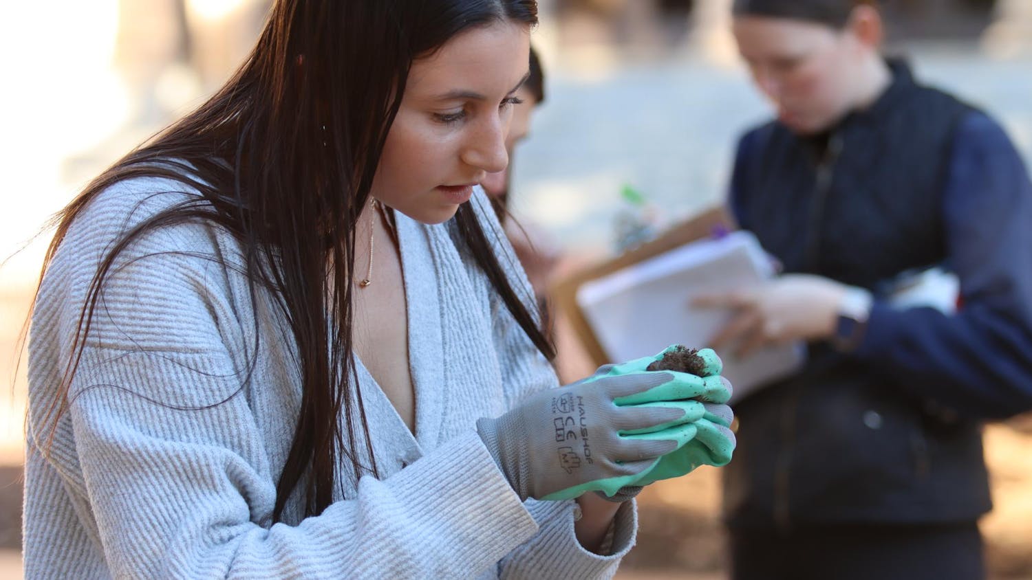 Second-year student Samantha Addeo analyzes items found in the ground on the Horseshoe on Feb. 14, 2024. Some of the artifacts the students find will be on display in the McKissick Museum.
