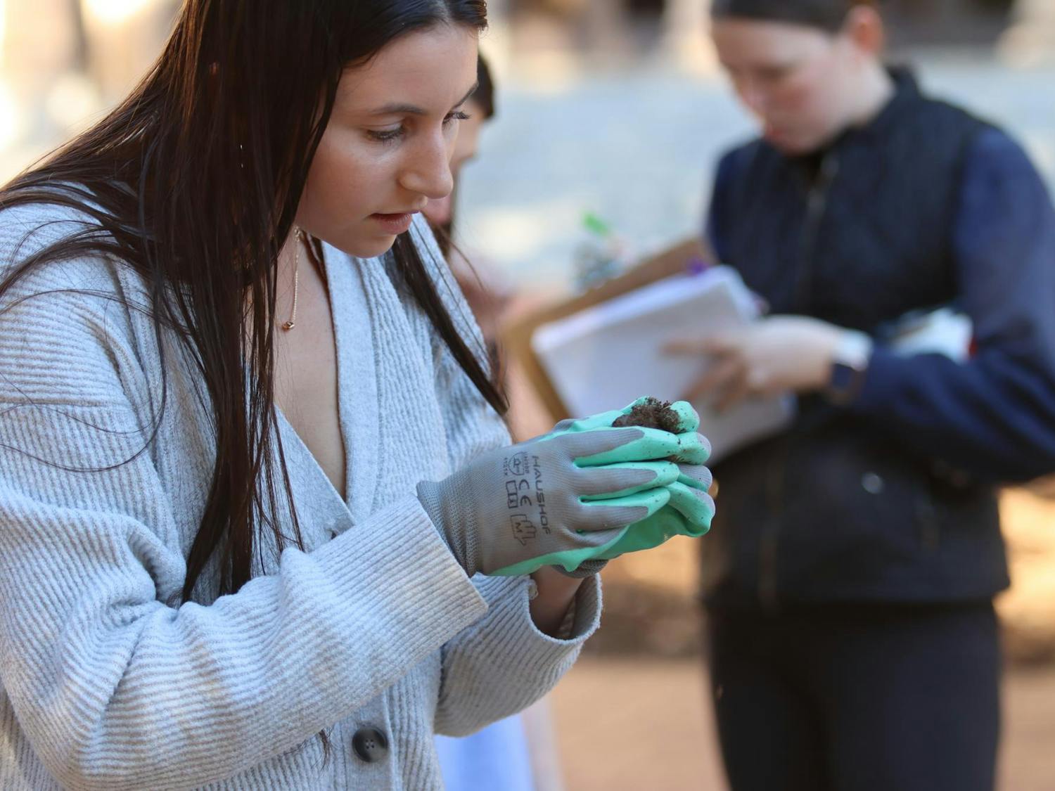 Second-year student Samantha Addeo analyzes items found in the ground on the Horseshoe on Feb. 14, 2024. Some of the artifacts the students find will be on display in the McKissick Museum.