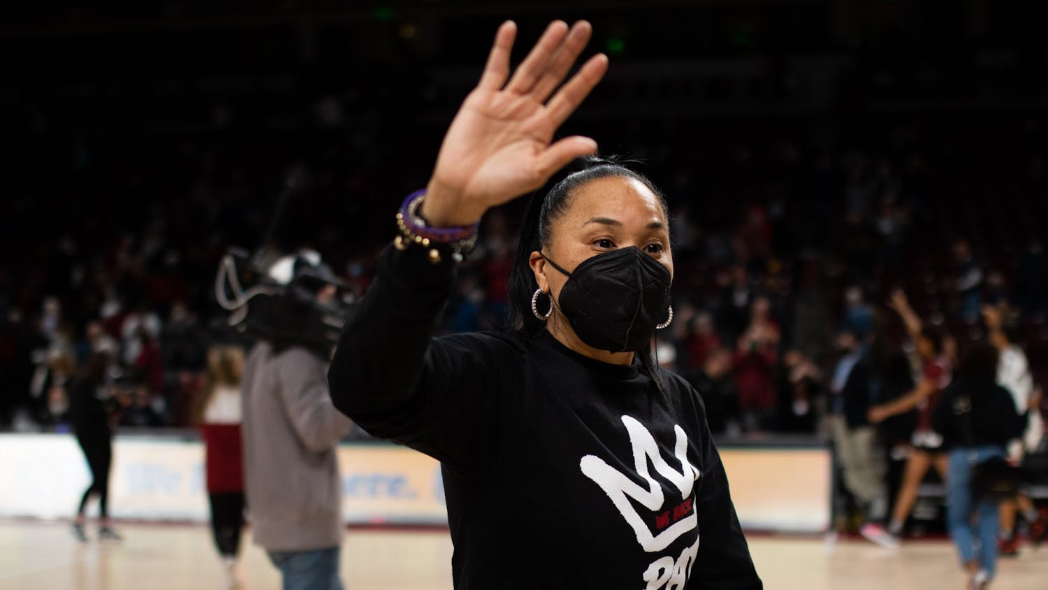 FILE— Coach Dawn Staley waves to fans as she leaves the court following a game against Vanderbilt at Colonial Life Arena on Jan. 24, 2022.