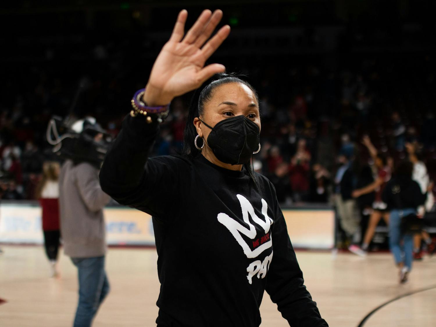 FILE— Coach Dawn Staley waves to fans as she leaves the court following a game against Vanderbilt at Colonial Life Arena on Jan. 24, 2022.