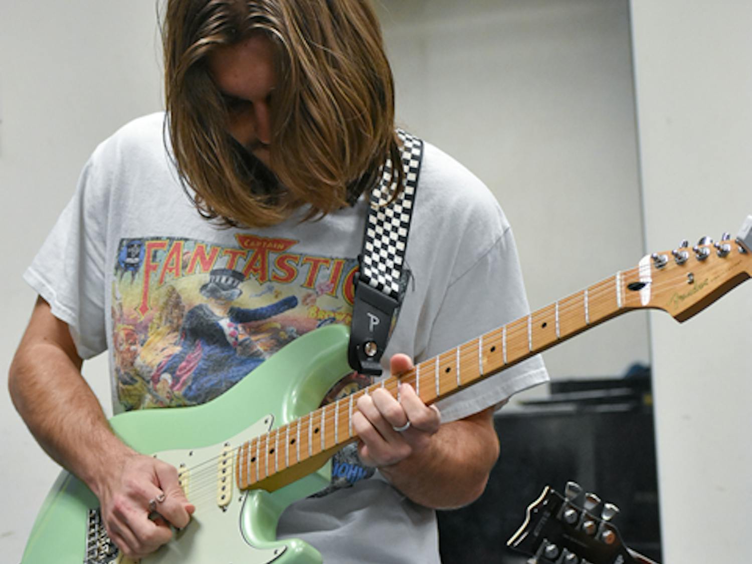 Milvid plays “Santeria” by Sublime on his electric guitar on Feb. 7, 2023. Milvid, along with the rest of the ensemble, practiced for a performance at the Koger Center on Feb. 13, 2023.