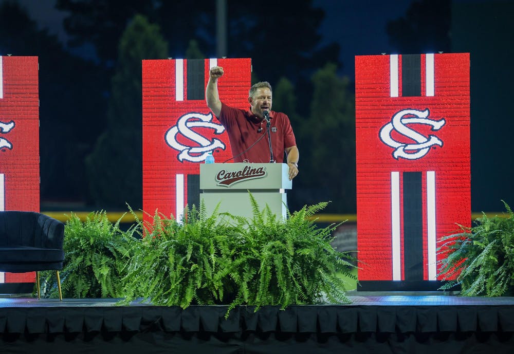 <p>Head Coach Kevin Schnall raises his fist as he gives a speech about joining the Gamecock family on June 12, 2026 at Founders Park. Schnall was hired after spending two years as head coach at Coastal Carolina.</p>