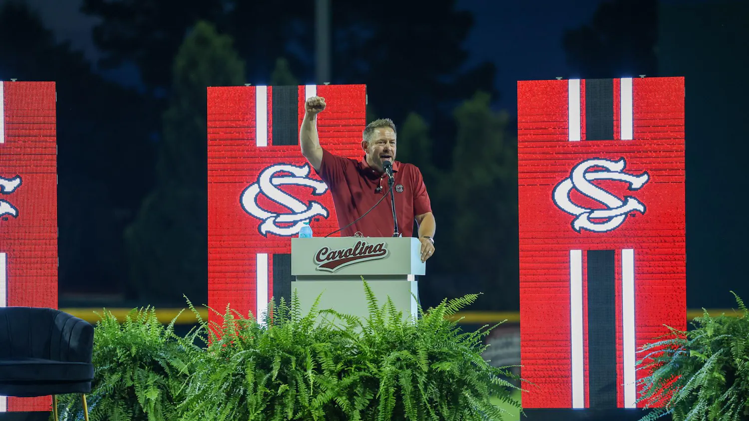 Head Coach Kevin Schnall raises his fist as he gives a speech about joining the Gamecock family on June 12, 2026 at Founders Park. Schnall was hired after spending two years as head coach at Coastal Carolina.