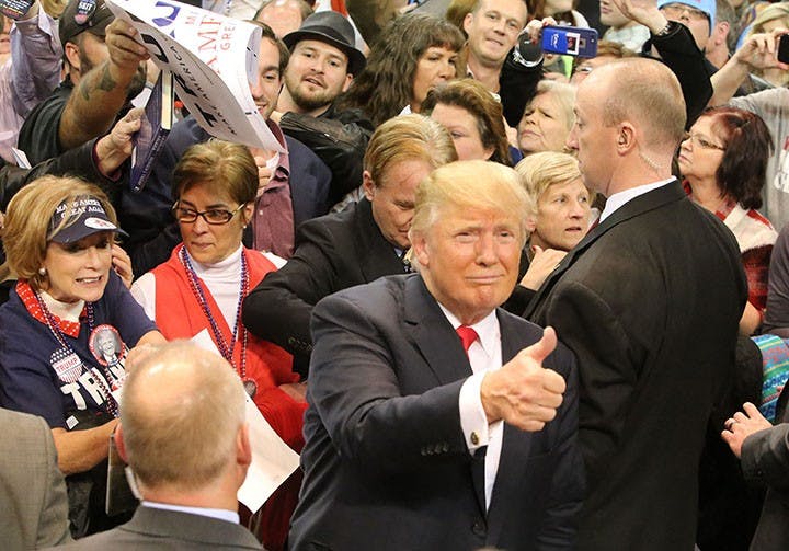 Republican presidential candidate Donald Trump gives a thumbs-up during a rally at the Mississippi Coast Coliseum in Biloxi, Miss., on Saturday, Jan. 2, 2016. (John Fitzhugh/Biloxi Sun Herald/TNS)