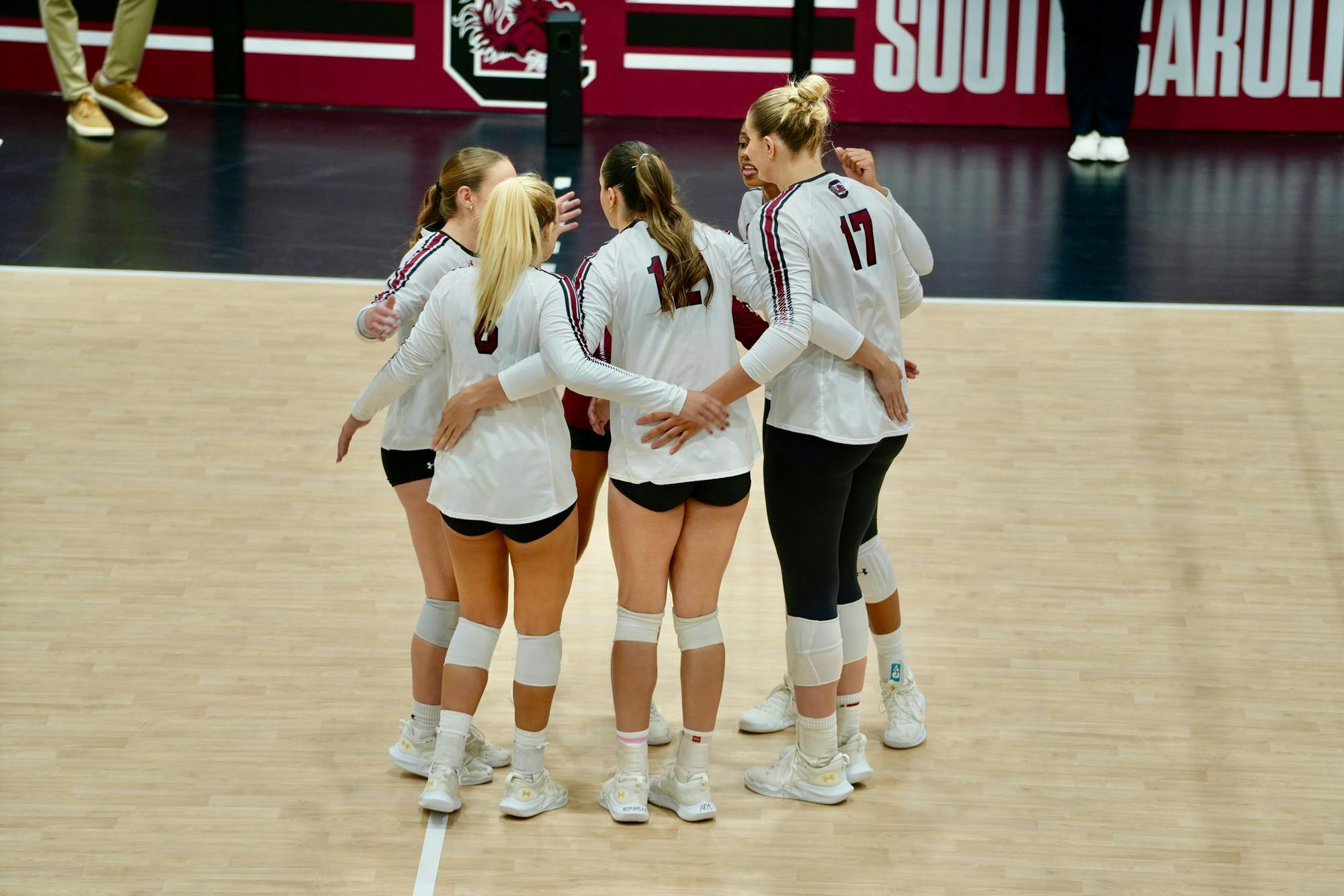South Carolina players huddle together before a serve during the match against Alabama on Oct. 19, 2025, at the Carolina Volleyball Center. The Gamecocks fell to the Crimson Tide in straight sets, 3-0.