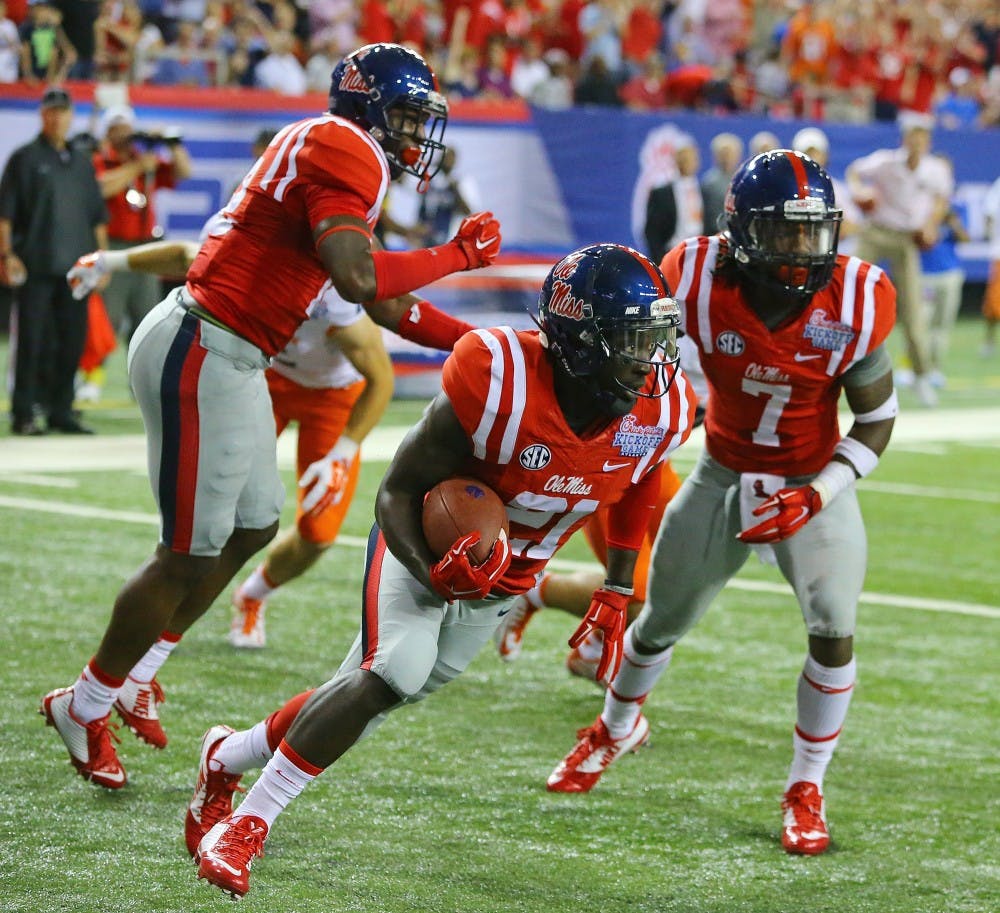 Mississippi defensive back Senquez Golson intercepts Boise State in the end zone during the first quarter at the Georgia Dome in Atlanta on Thursday, Aug. 28, 2014. (Curtis Compton/Atlanta Journal-Constitution/MCT)