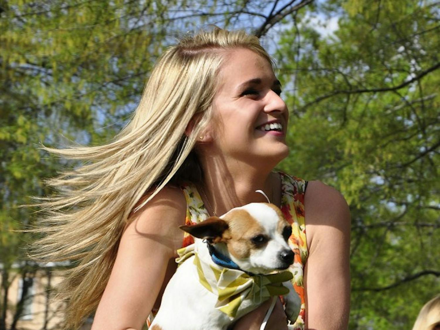 Fifteen dogs up for adoption walk the runway at the second annual Doggie Fashion Show Monday on Davis Field. Donations from the event went to support the ASPCA.