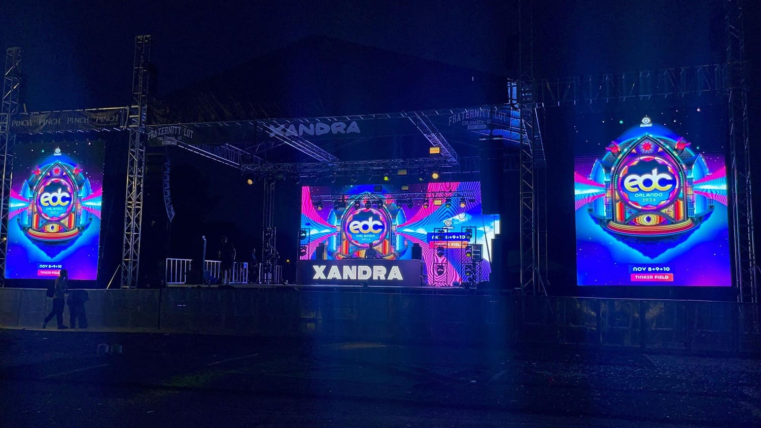 A large stage with screens introducing DJ Xandra stand at the Fraternity Lot on Nov. 5, 2024. Students gathered at the Fraternity Lot Tuesday night to enjoy the day off from classes.