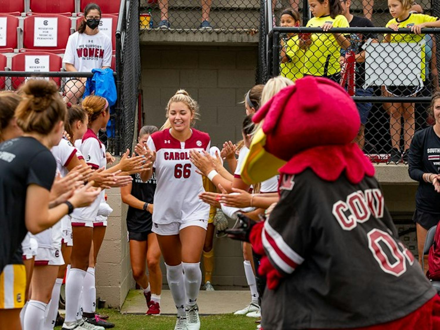 Cocky and the Gamecock women's soccer team welcome Freshman Forward Gracie Falla onto the field during their matchup with Eastern Carolina University on August 21, 2022.