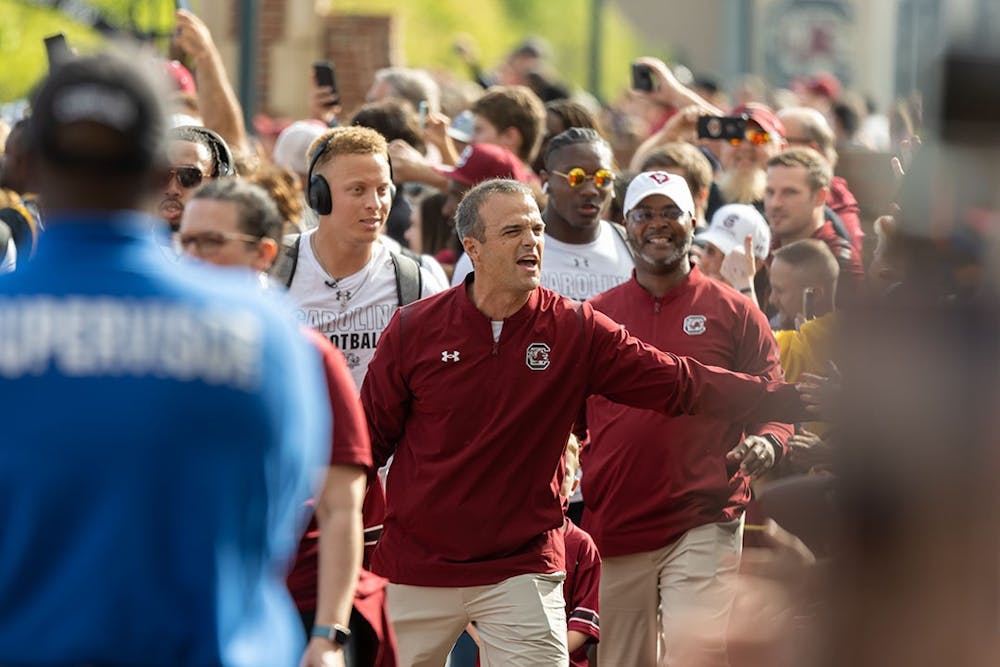 Head football coach Shane Beamer and redshirt junior quarterback Spencer Rattler with the team in tow walking into Williams-Brice Stadium for the Garnet and Black Spring Game on April 17, 2022.
