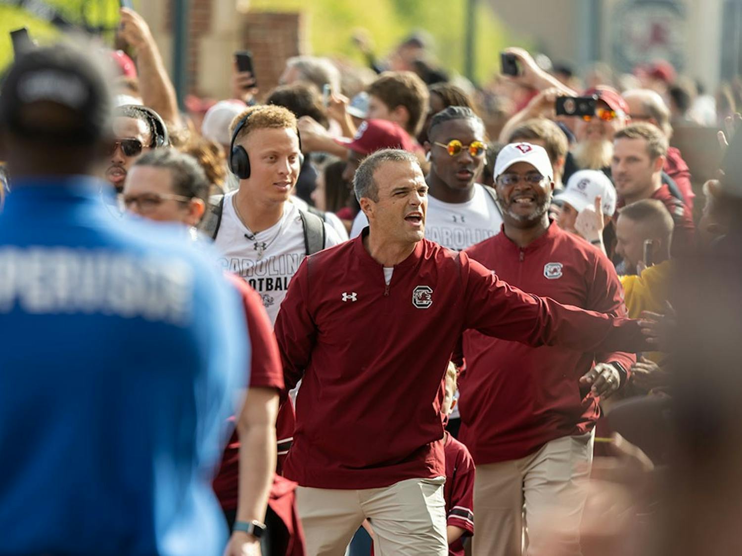 Head football coach Shane Beamer and redshirt junior quarterback Spencer Rattler with the team in tow walking into Williams-Brice Stadium for the Garnet and Black Spring Game on April 17, 2022.