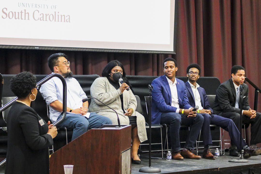Lauren Mims, an associate attorney for Turner Padget Law, talks about her experience in being black in the workspace during the Alpha Kappa Psi panel in the Russell House Ballroom on Feb. 20, 2023. The panel discussed the challenges and biases that many minorities face in both their education and careers.