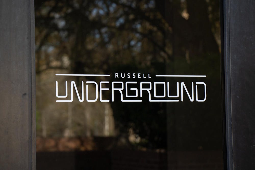 <p>The doors to Russell Underground, a multipurpose venue for students, show a logo on March 11, 2024. The Music Industry Studies program started Live at the Underground to create a platform for local artists to perform on Wednesday nights.</p>