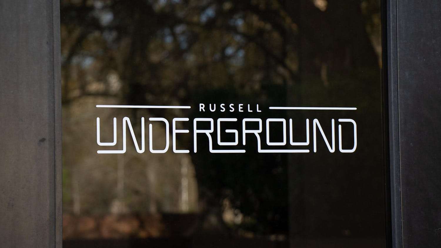 The doors to Russell Underground, a multipurpose venue for students, show a logo on March 11, 2024. The Music Industry Studies program started Live at the Underground to create a platform for local artists to perform on Wednesday nights.