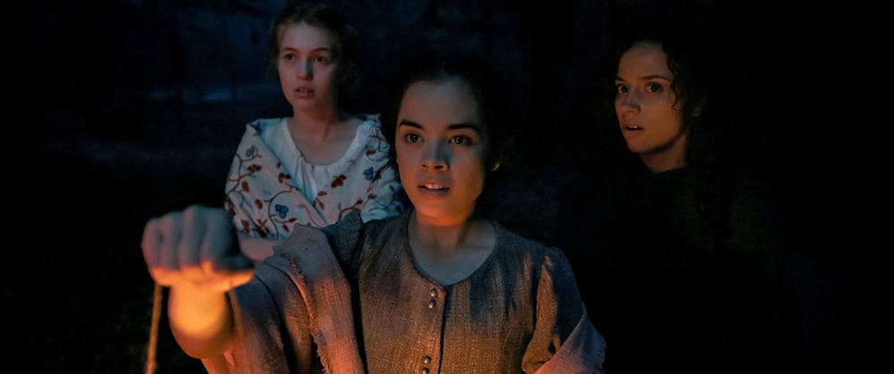 From left to right: Julia Rehwald, Olivia Scott Welch and Kiana Madeira in "Fear Street: Part 3 — 1666." (Netflix/TNS)