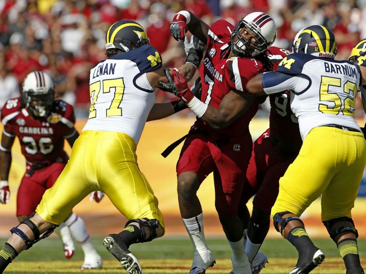 South Carolina defensive end Jadeveon Clowney (7) is double-teamed as he rushes the Michigan quarterback in the Outback Bowl at Raymond James Stadium in Tampa, Florida, on Tuesday, January 1, 2013. (Gerry Melendez/The State/MCT)