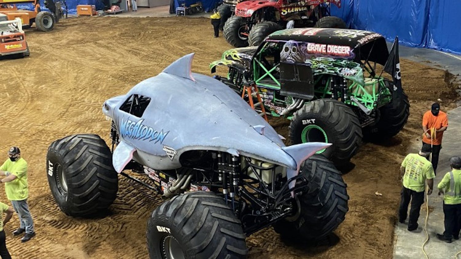 A row of monster trucks sit inside of Colonial Life Arena during Monster Jam's visit to Columbia.