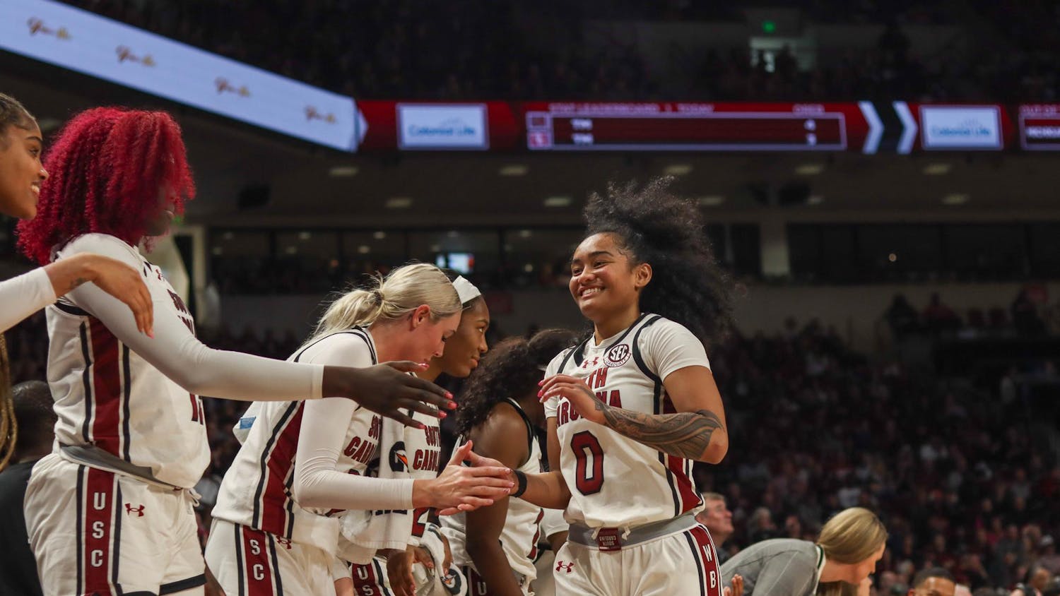 Senior Guard Te-Hina Paopao comes off the court and is congratulated by fellow teammates during the Oklahoma game on Jan. 19, 2025. The 101-60 score makes the Gamecocks 5–0 against SEC opponents.
