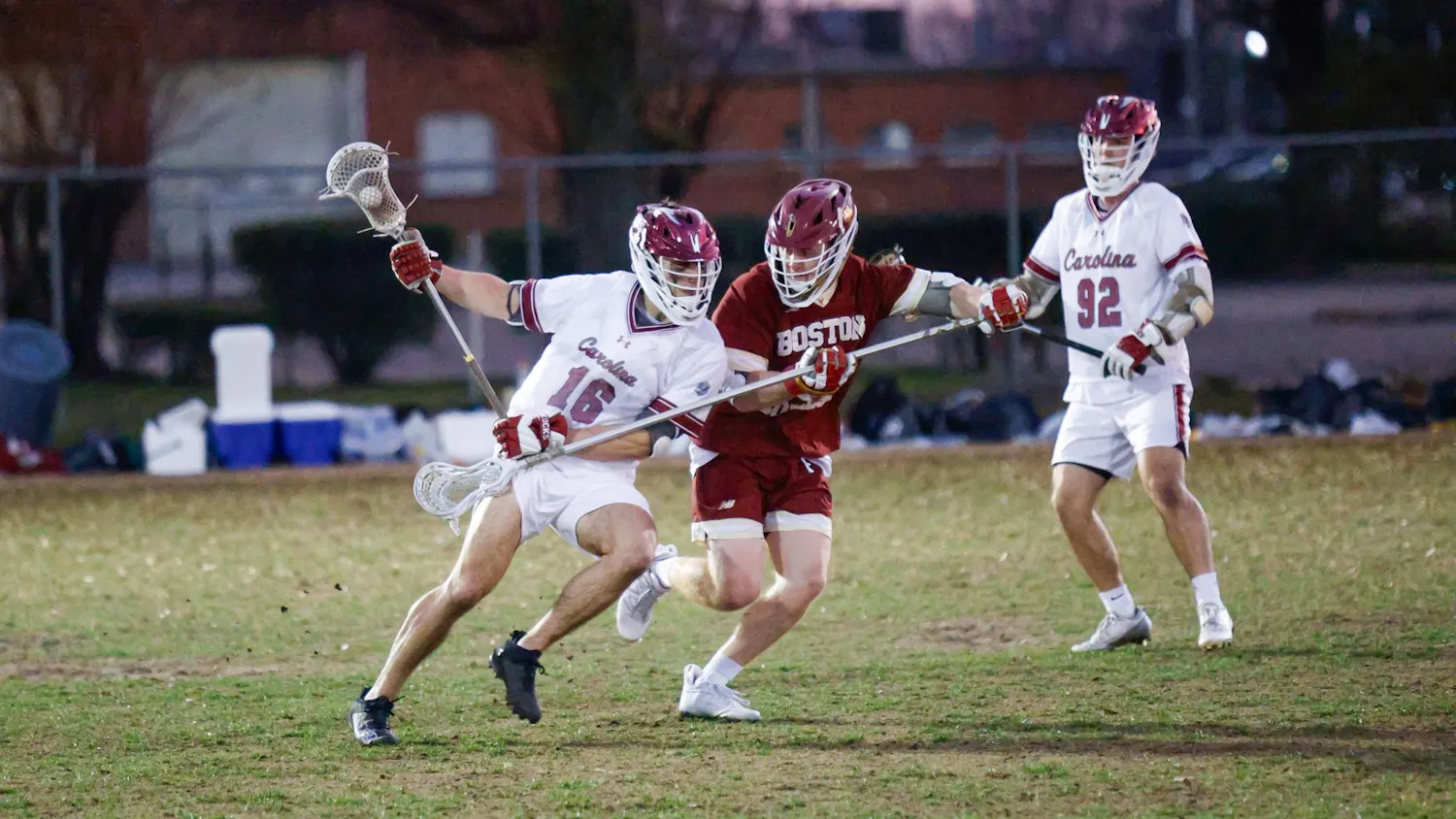 Sophomore midfielder Jaden Mullins pushes against a defending player while carrying the ball during the game against Boston College on Feb.7, 2025. The Gamecocks defeated the Eagles 10-9.