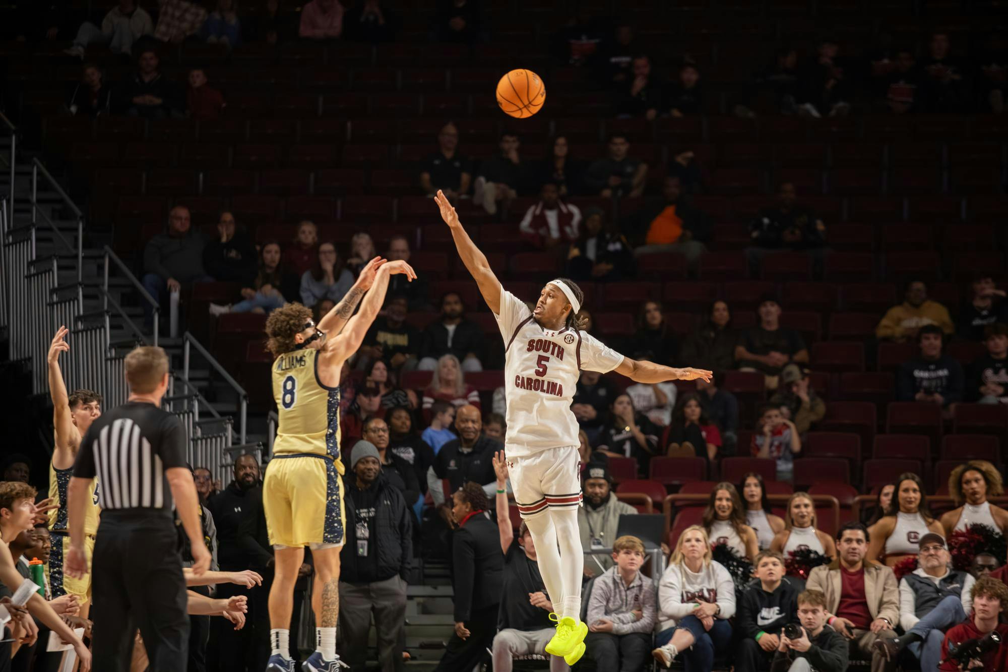 Redshirt senior guard Meechie Johnson attempts to block the shot of an opposing player during the game against Charleston Southern on Nov. 28, 2025. Johnson made five defensive rebounds during his 29 minutes of playtime.