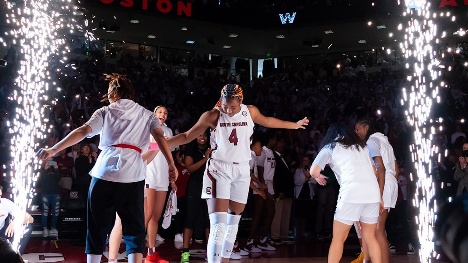 FILE — Junior forward Aliyah Boston dances with graduate guard Lele Grissett as the starting lineup for the South Carolina Gamecocks is announced for the game on Sunday, Feb. 20, 2022 against the Tennessee Volunteers at Colonial Life Arena. Boston ended the season with 21 straight double-doubles.&nbsp;