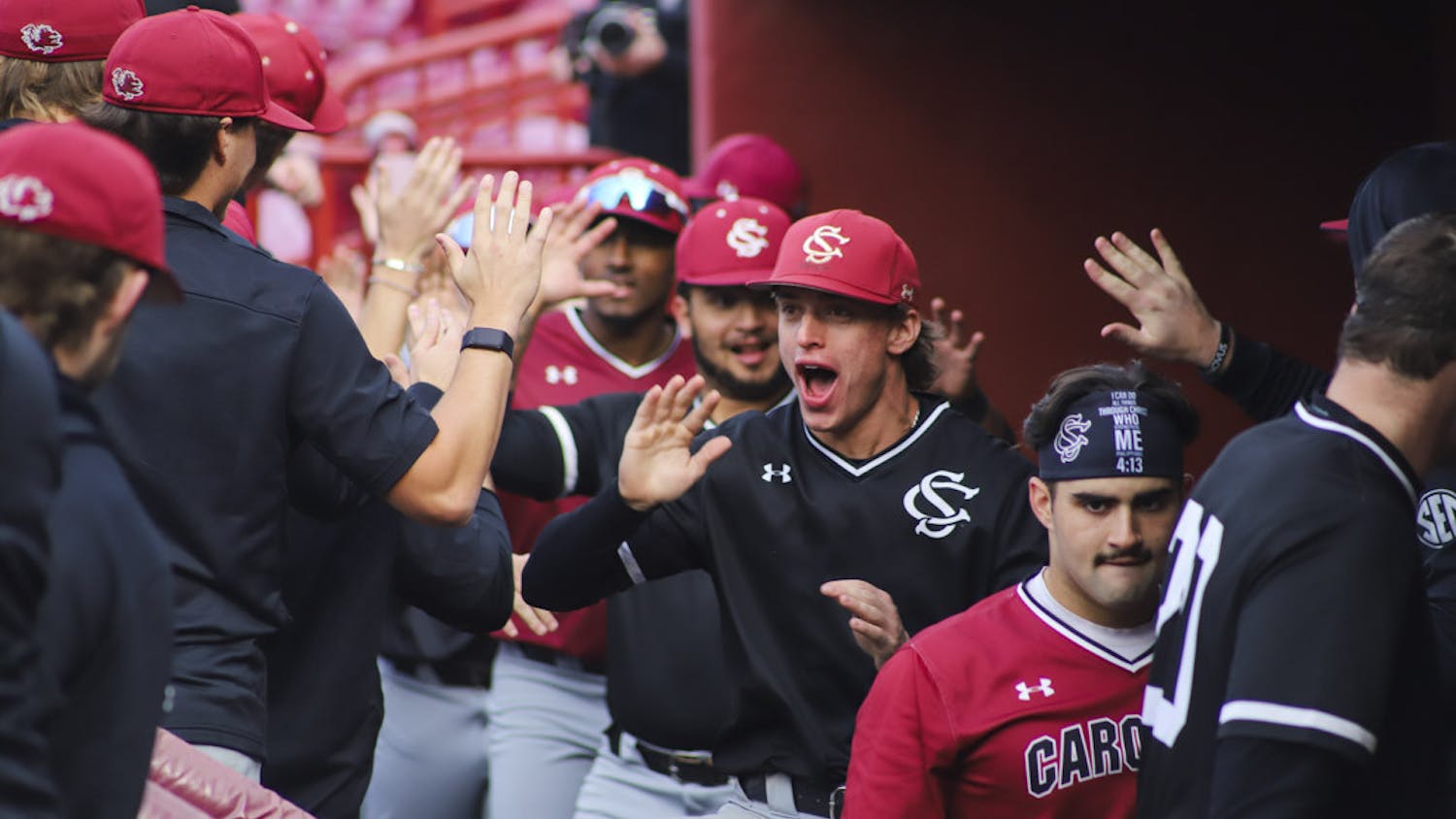 Players from team Black hype each other up after scoring the winning run during its first scrimmage of the 2023 season against team Garnet on Jan. 27. South Carolina baseball will start its 2023 season on Feb. 17 against the University of Massachusetts Lowell.