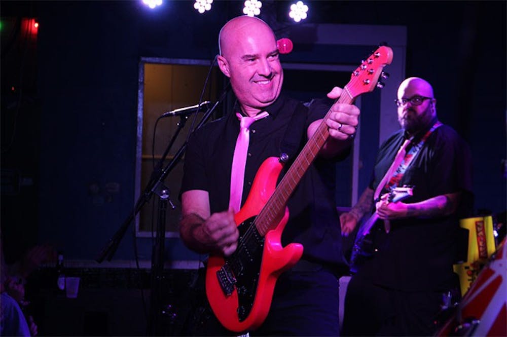 <p>Lead vocalist and guitarist Tom Mann plays the guitar at Breakers Nov. 14, 2019. When in Columbia, South Carolina, Spank! The 80s plays for bars and Greek life events. &nbsp;</p>