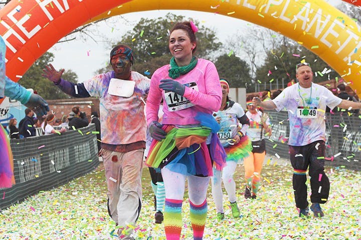 	A runner rocks a rainbow tutu and socks while crossing the finish line.
Heidi Stone/The Daily Gamecock