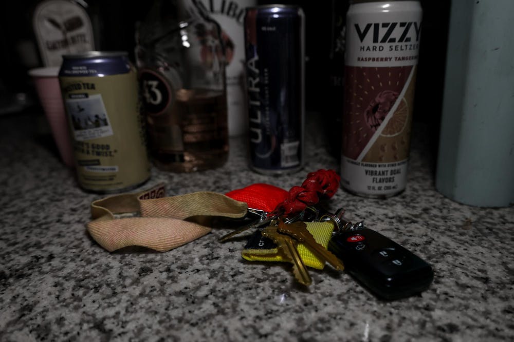 <p>A photo illustration of keys surrounded by alcoholic beverages on Feb. 1, 2024. Three hundred and thirty-five people died in 2022 due to impaired driving in South Carolina.</p>