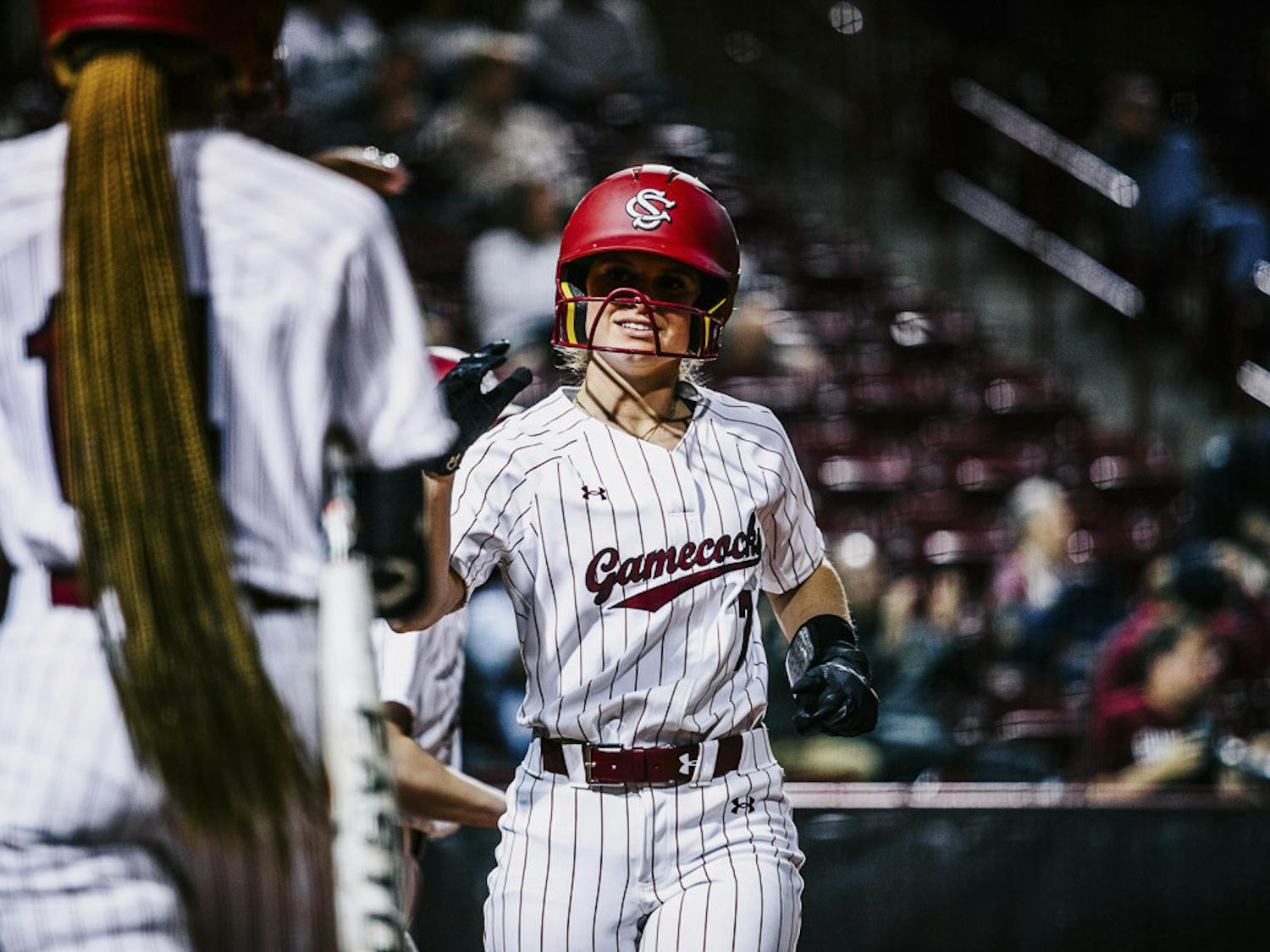 Sophomore catcher/infielder Giulia Desiderio greets her teammates after she scores the first run in the game between South Carolina and the College of Charleston at Carolina Softball Stadium at Beckham Field on February 15, 2023. The Gamecocks beat the Cougars 8-0.&nbsp;