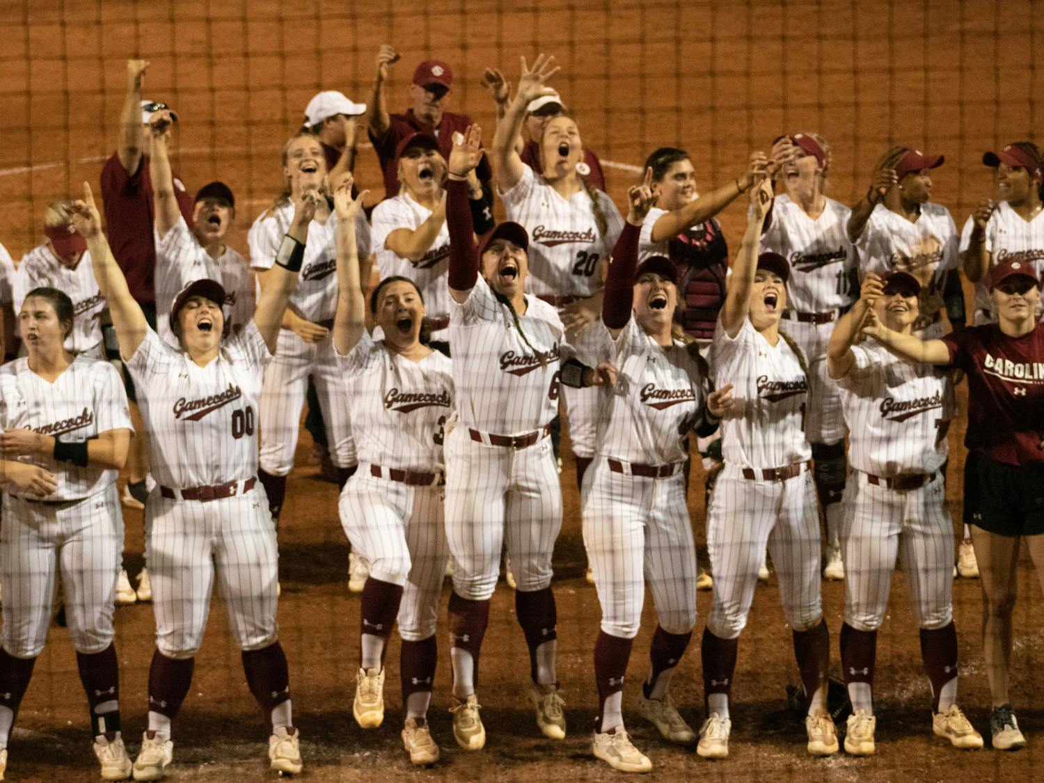 Members of the Gamecock softball team celebrate their comeback victory against Florida on March 31, 2023, at Beckham Field. The Gamecocks beat the Gators 13-10, winning the first game in the series.