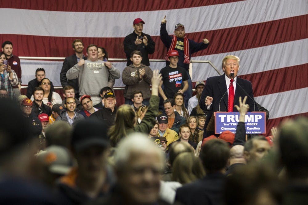 Presidential hopeful Donald J. Trump addresses economic concerns and answers audience questions at the T. Ed Garrison Arena in Clemson, South Carolina.
