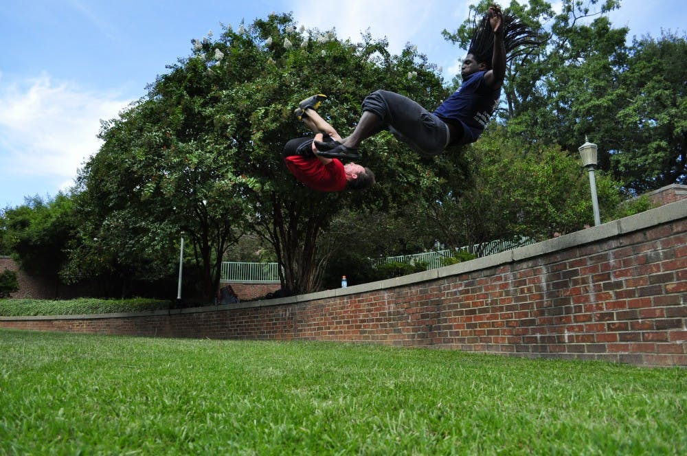 	Johnson and Travis Johnston doing punch front tucks in unison