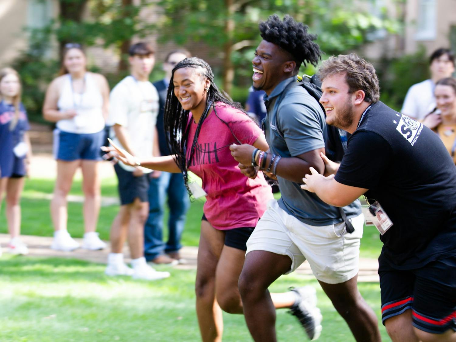 Two incoming students race to be the first to bring an orientation leader to their group. This game is played during orientation sessions throughout the summer to help new students have fun and make friends before starting their freshman year in the fall.