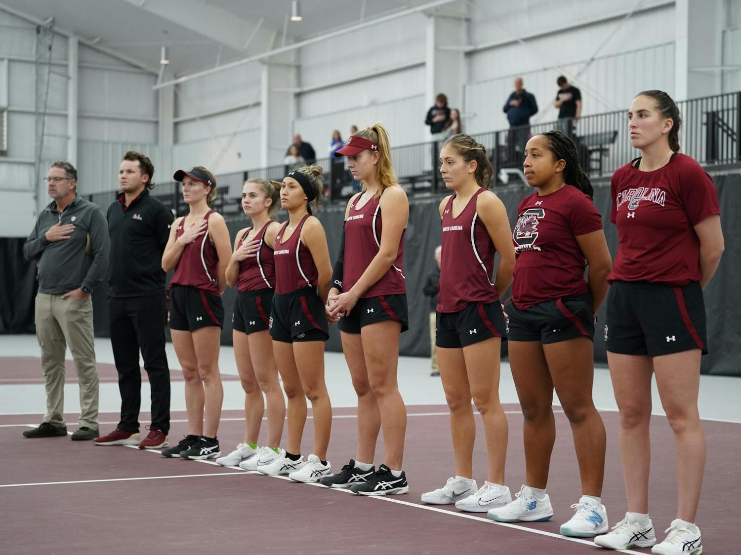 The Gamecock women's tennis team lines up for the national anthem before its match on Jan. 21, 2024. The South Carolina Gamecocks beat the Presbyterian Blue Hoses 4-0.