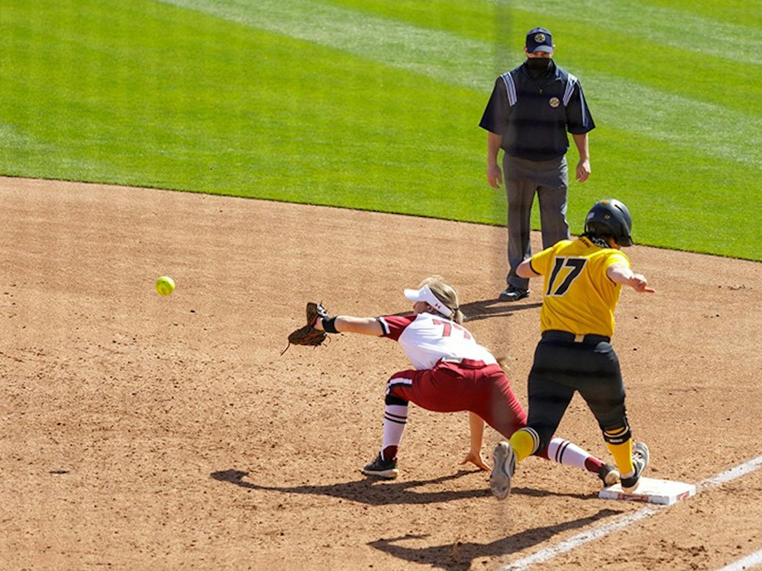 Junior infielder Kassidy Krupit stretches out in hopes of getting Missouri’s batter out at first base.&nbsp;