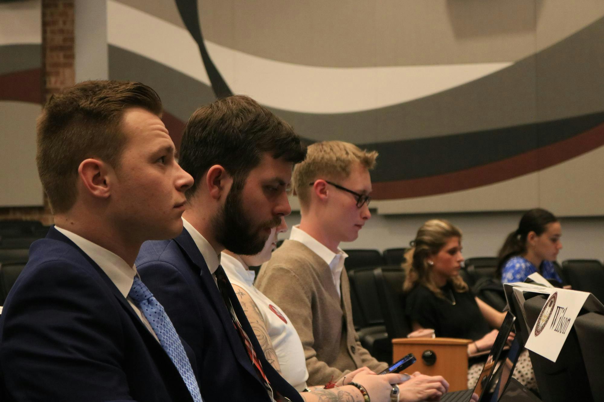 FILE — Senators listen to the Student Government meeting on Feb. 18, 2026, at the Russell House Theater. A bill to simplify chapter one of the Student Government codes was passed by the senate.