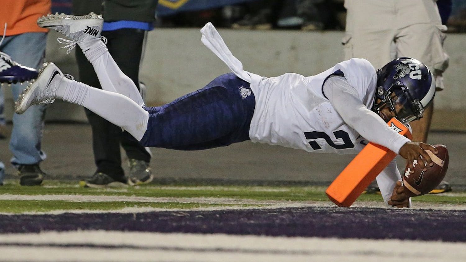 TCU quarterback Trevone Boykin (2) dives into the Kansas State end zone with a touchdown on a 14-yard run in the fourth quarter at Snyder Family Stadium in Manhattan, Kan., on Saturday, Oct. 10, 2015. TCU won, 52-45. (Paul Moseley/Fort Worth Star-Telegram/TNS)