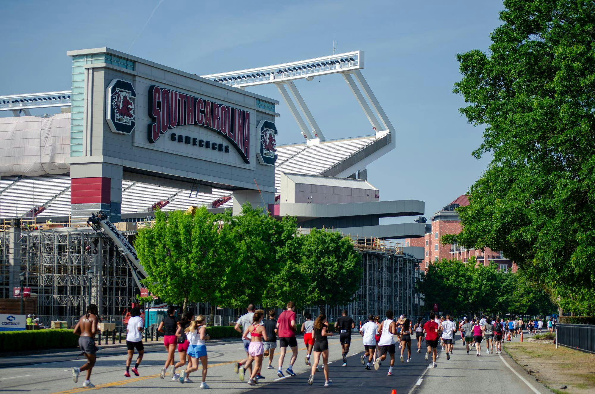 Participants of the fifth annual Cocky Trot 5K run in front of Williams-Brice Stadium on April 25, 2026. The stadium, currently closed during construction, is usually the starting location of the Cocky Trot 5K.