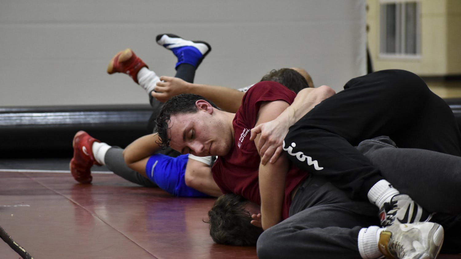 Members of the University of South Carolina's club wrestling team work on making pins during their practice at Strom Thurmond Wellness and Fitness Center on Feb. 1, 2023. The wrestling team practices on Mondays and Wednesdays to prepare for tournaments.&nbsp;
