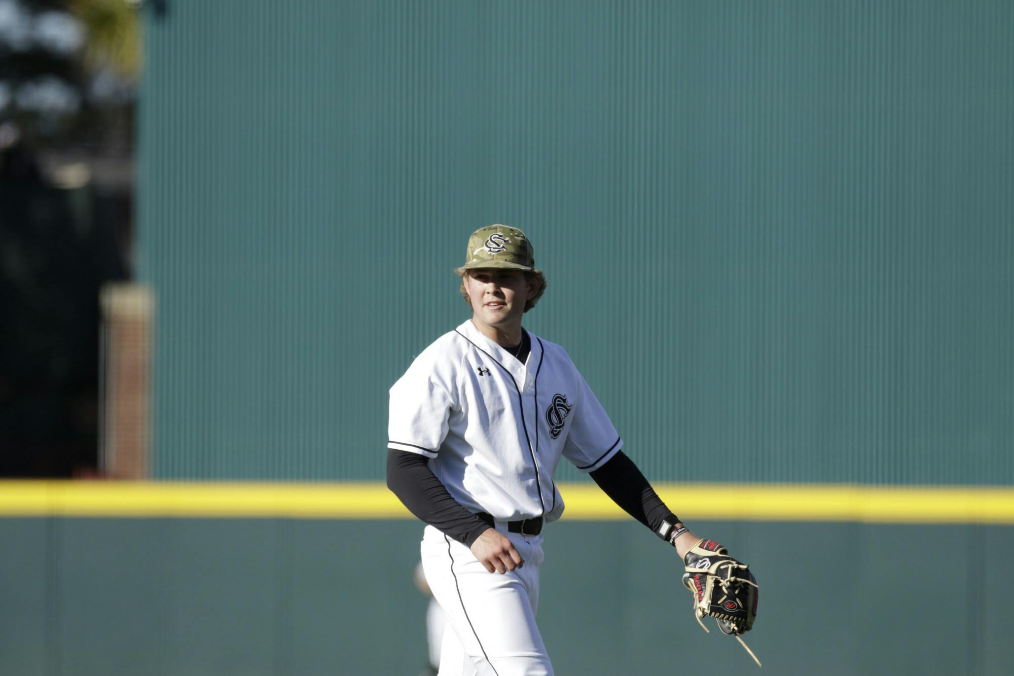 Sophomore pitcher Eli Jones smiles after striking out the batter from Presbyterian College and closing the inning at Founders Park on March 14, 2023. Jones had six strikeouts in the 5-0 win over the Blue Hose.