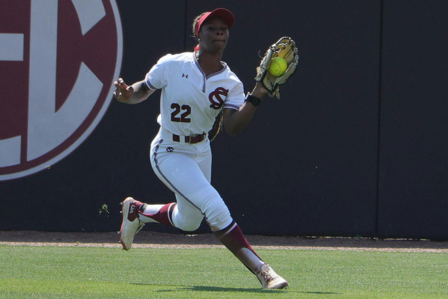 Sophomore outfielder Nia McKnight tracks down a fly ball in the outfield against LSU at Carolina Softball Stadium at Beckham Field in Columbia, South Carolina, on March 22, 2026. McKnight secures the catch while moving toward the wall.