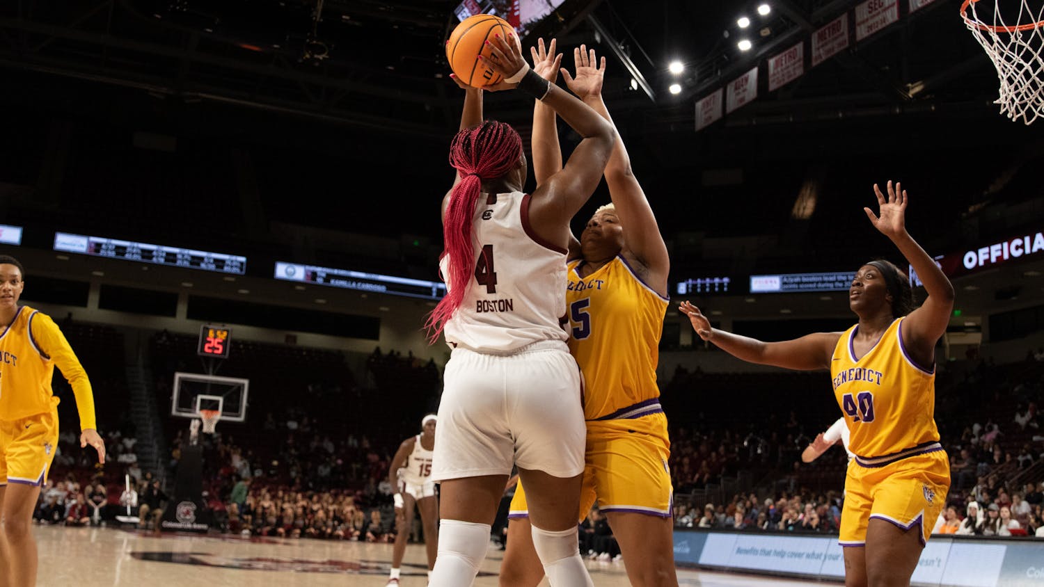 Senior forward Aliyah Boston holds the ball above her head and away from a Benedict College player during the exhibition game at Colonial Life Arena on Oct. 31, 2022. Boston was recently unanimously named to the AP Preseason All-American team.&nbsp;