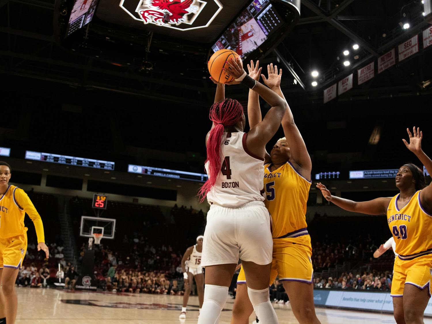 Senior forward Aliyah Boston holds the ball above her head and away from a Benedict College player during the exhibition game at Colonial Life Arena on Oct. 31, 2022. Boston was recently unanimously named to the AP Preseason All-American team.&nbsp;