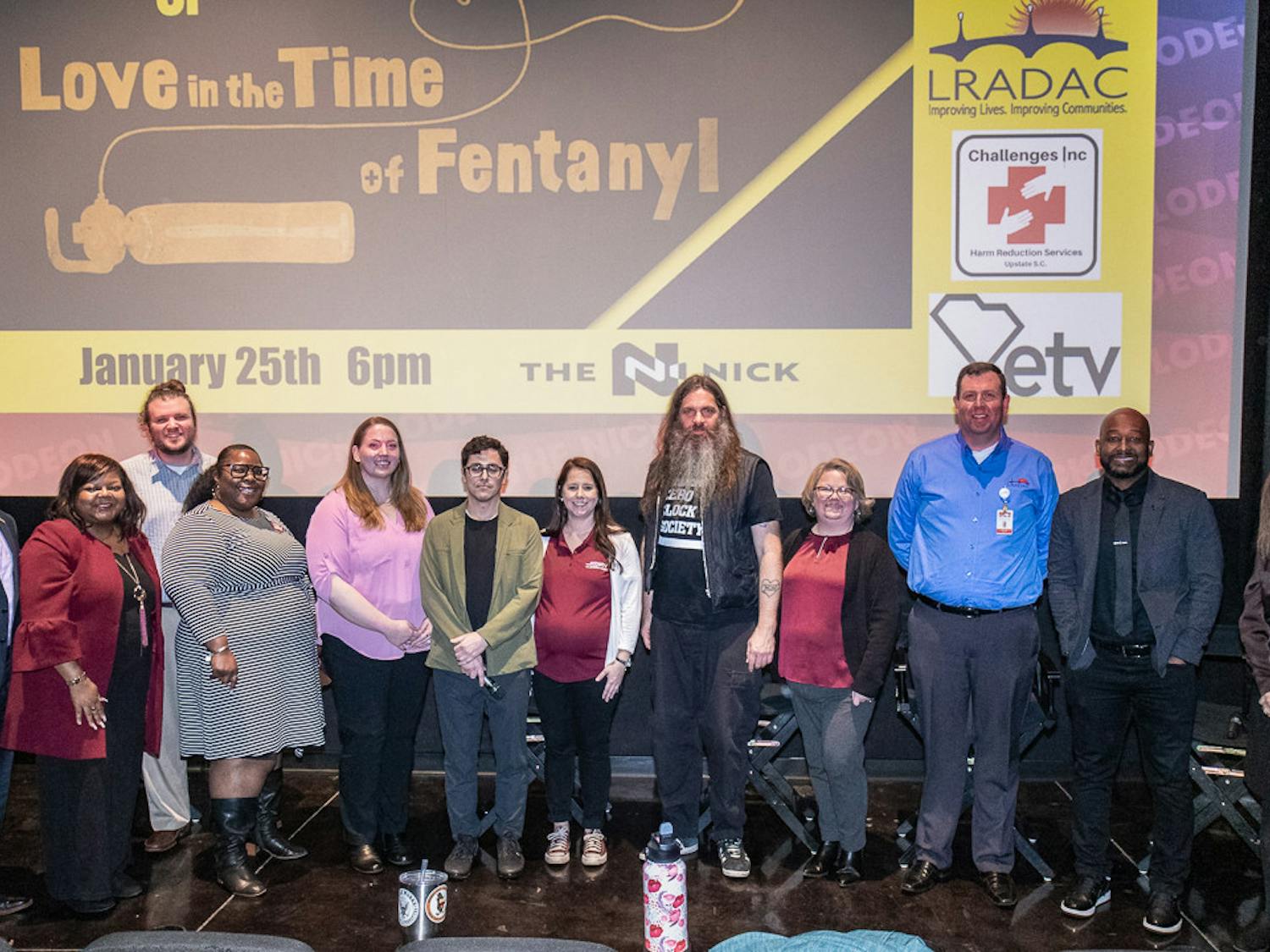 The staff and panelists of the prescreening of "Love in the Time of Fentanyl" pose in front of the screen at Nickelodeon Theatre on Jan. 25, 2023. The documentary spoke on the dangers of fentanyl and the steps that the Overdose Prevention Society in Vancouver, Canada is taking to cut down on the amount of overdoses it creates.&nbsp;