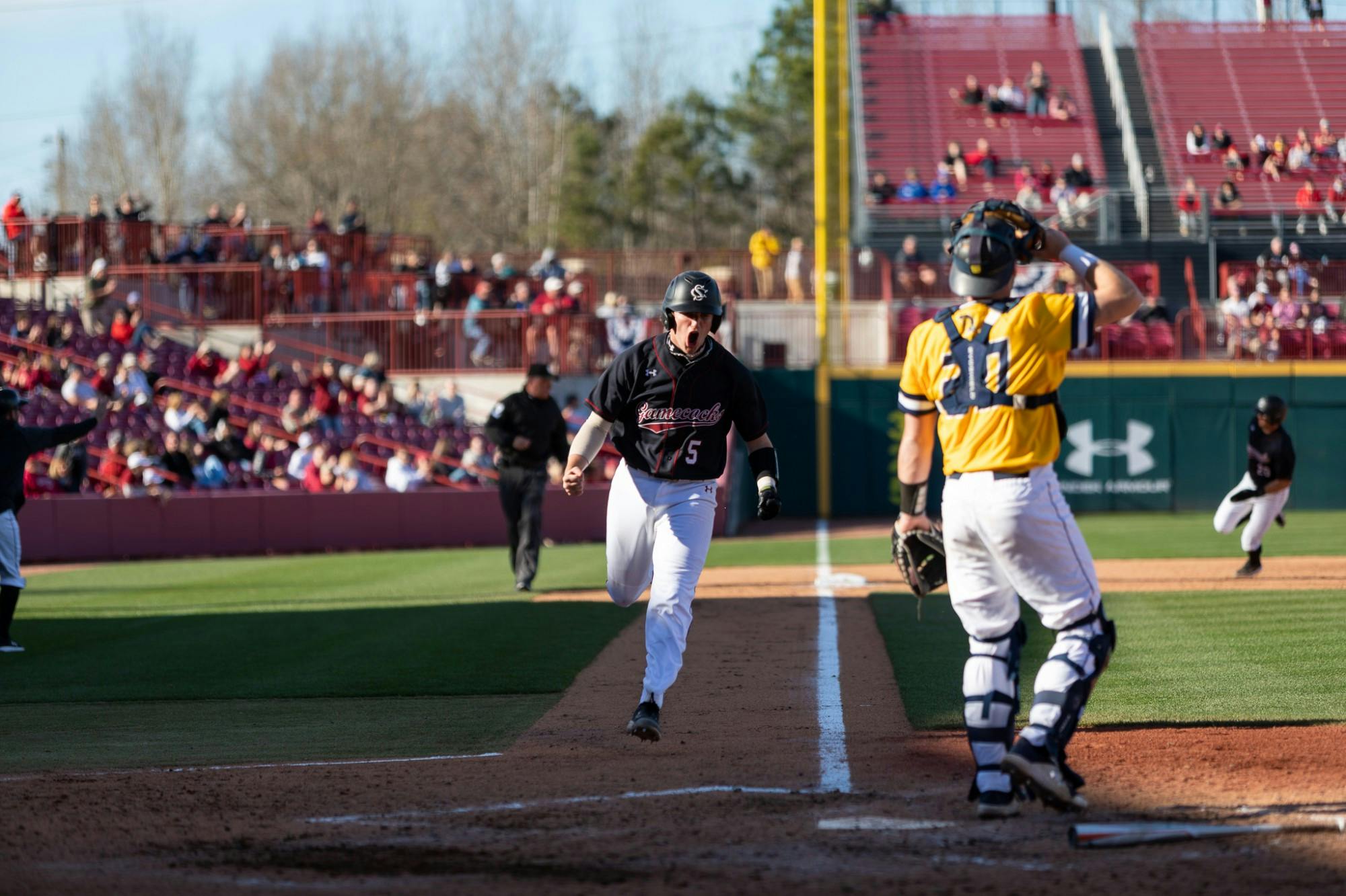 USC Freshman Talmadge LaCroy runs to home plate during the last game of the series on Feb. 20, 2022. Carolina defeated UNCG in the last game of their series 8-7.&nbsp;