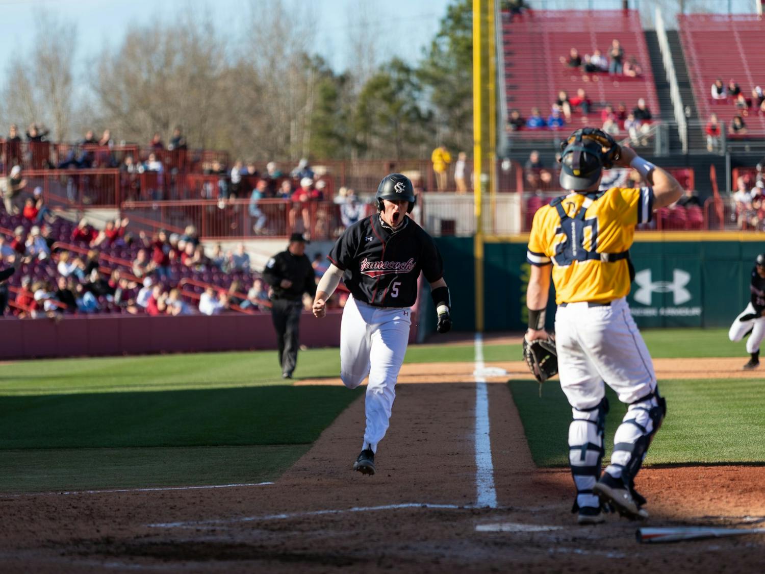 USC Freshman Talmadge LaCroy runs to home plate during the last game of the series on Feb. 20, 2022. Carolina defeated UNCG in the last game of their series 8-7.&nbsp;