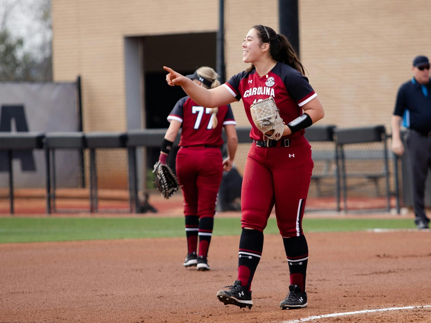 Graduate pitcher Kelsey Oh congratulates her teammate on a successful play during a game against Lipscomb on Saturday, Feb. 12, 2022 in Columbia, SC.