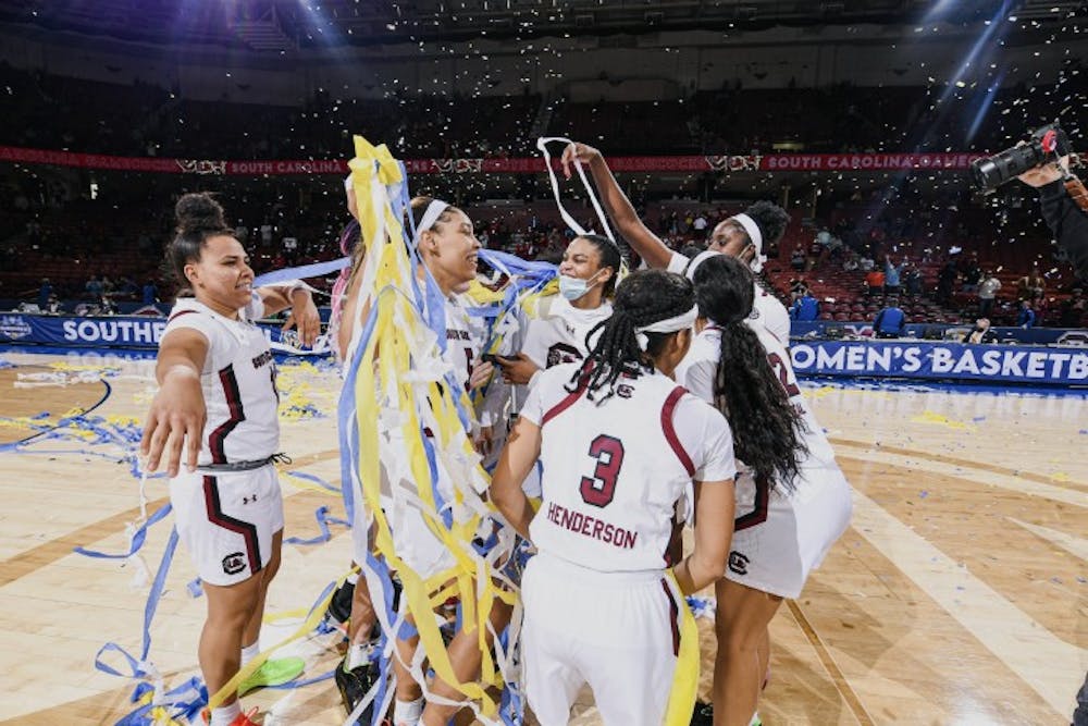 Members of the South Carolina women's basketball team celebrate after defeating Georgia 67-62 in the SEC Championship. This is the team's sixth SEC championship win in seven years.