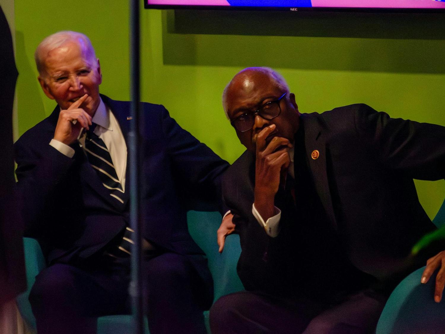Former President Joe Biden and U.S. Representative Jim Clyburn both listen to South Carolina Democratic Party Chair Christale Spain speak at an event honoring former President Biden at the Columbia Museum of Art at 1515 Main St., Columbia, South Carolina, on Feb. 27, 2026. Spain is the first black woman to hold her position, and she oversaw the 2024 Democratic Primary in South Carolina.